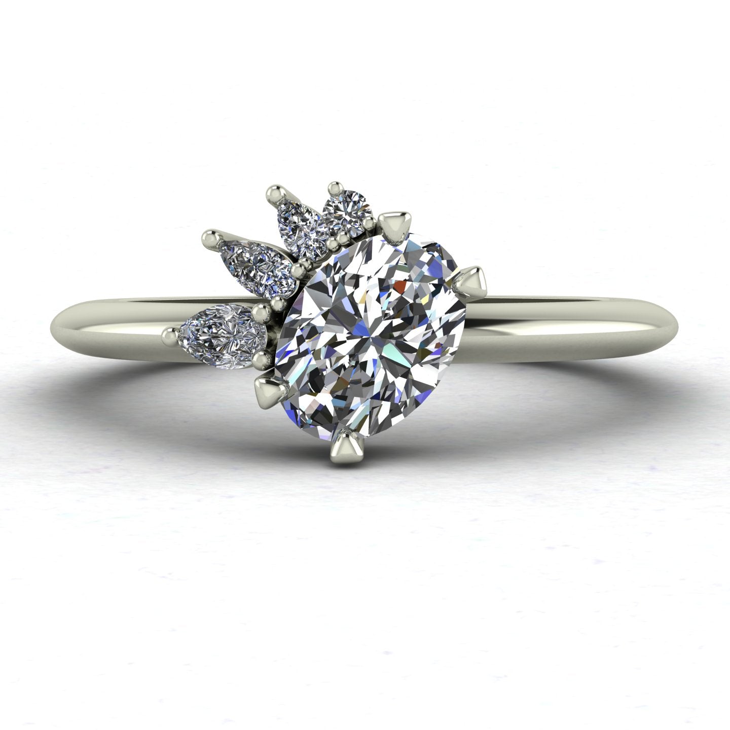 The Selene asymmetrical oval diamond cluster engagement ring on a white background