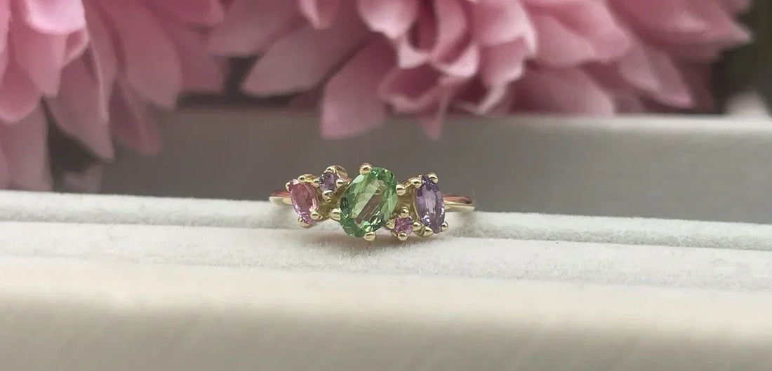 Atlantis pastel sapphire, diamond and tsavorite cluster engagement ring in 18ct yellow gold — handmade by Nude Jewellery London