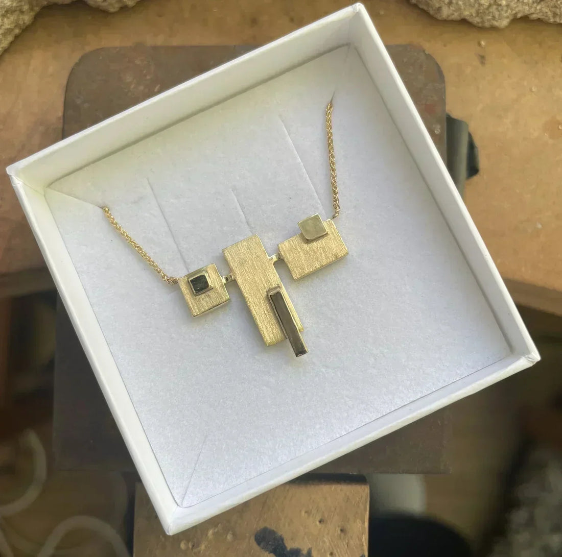 Liz's bespoke geometric gold necklace, remodelled from her family's recycled gold and handmade in our London studio