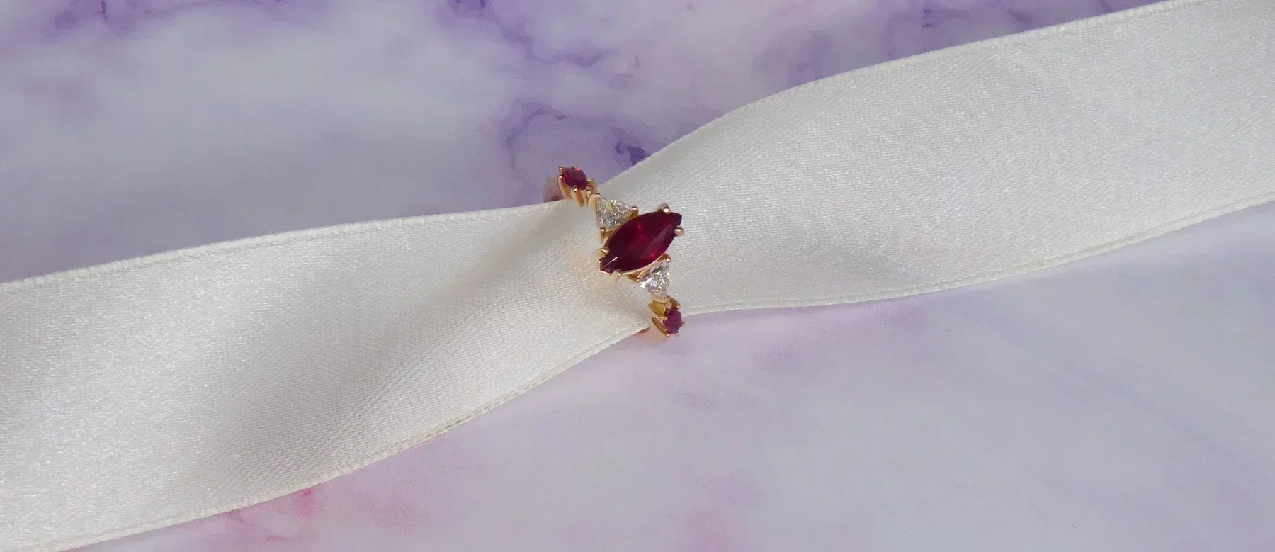 Contemporary marquise ruby engagement ring in 18ct rose gold, handmade in our London studio