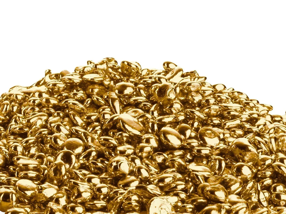 Close-up of gold casting grain used in fine jewellery making at Nude Jewellery's London studio