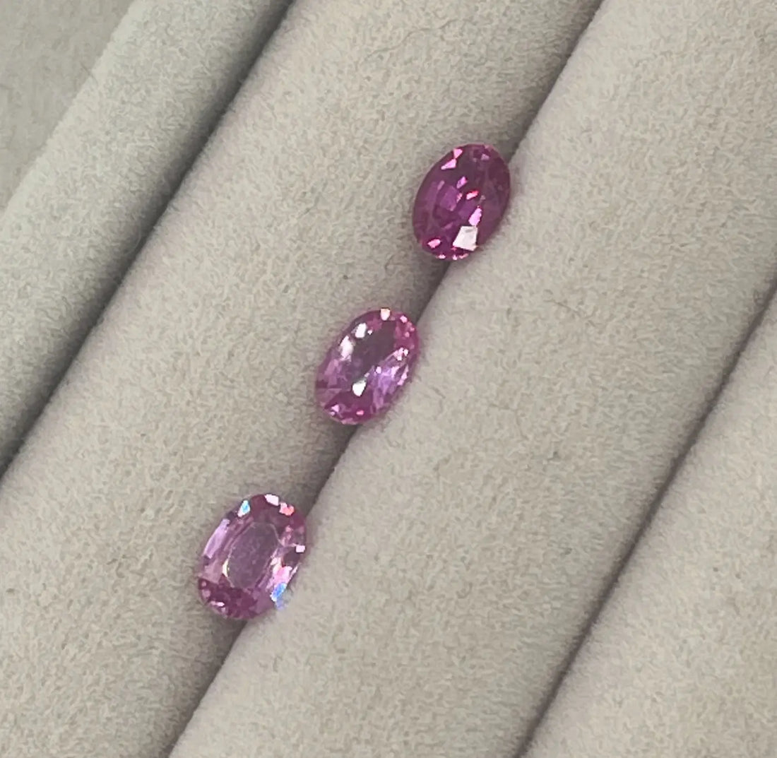 Oval pink sapphires on a velvet tray — gemstone selection at Nude Jewellery London
