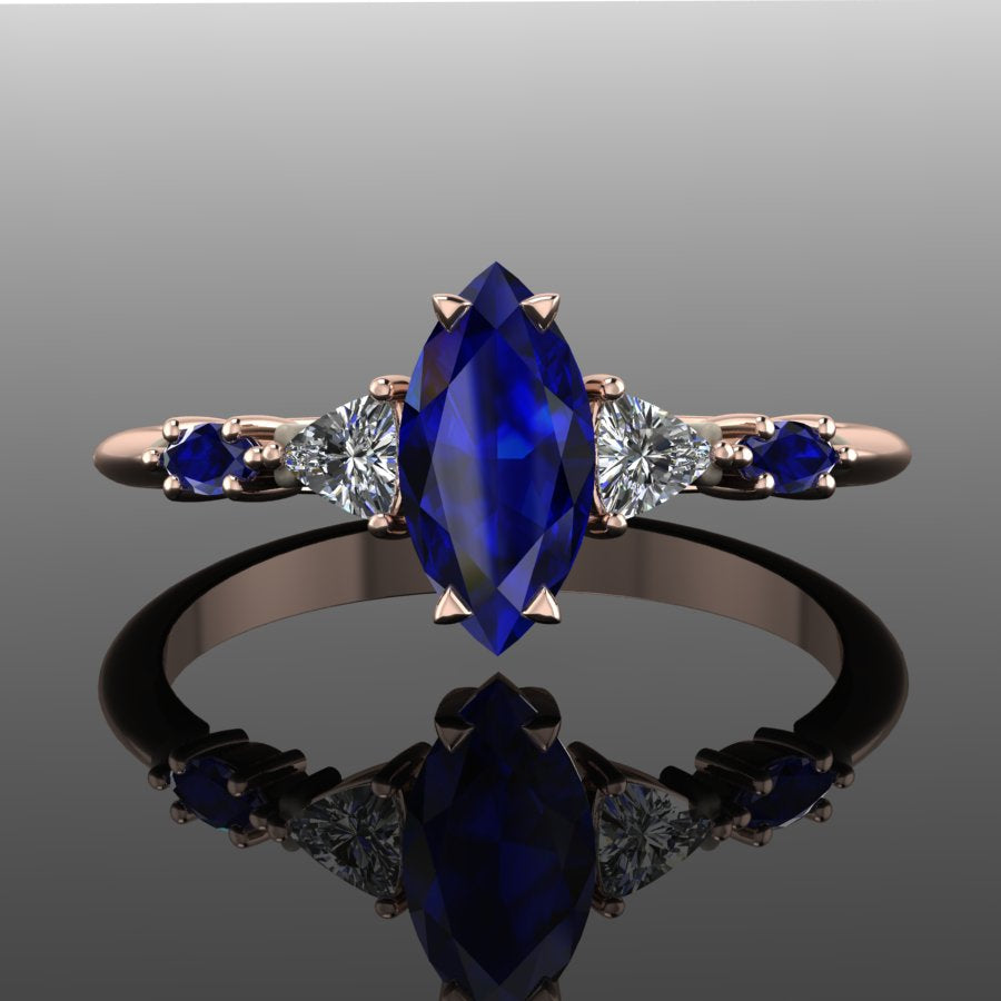 Blue sapphire engagement ring handcrafted in recycled gold, September birthstone jewellery by Nude Jewellery London