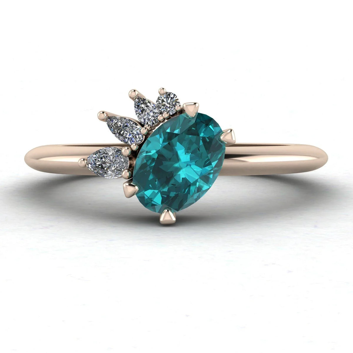 Selene oval teal sapphire and diamond engagement ring in 18ct rose gold front view showing asymmetric pear and round diamond cluster