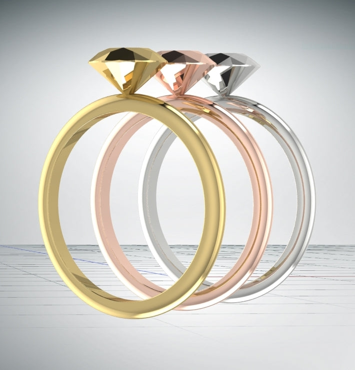 Handmade gold proposal ring featuring a solid silver sculpted diamond
