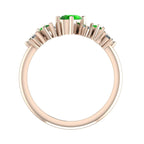 Through finger view of the Atlantis Paradise ring in 18ct rose gold featuring a vibrant green tsavorite garnet and a cluster of asymmetrical diamonds.