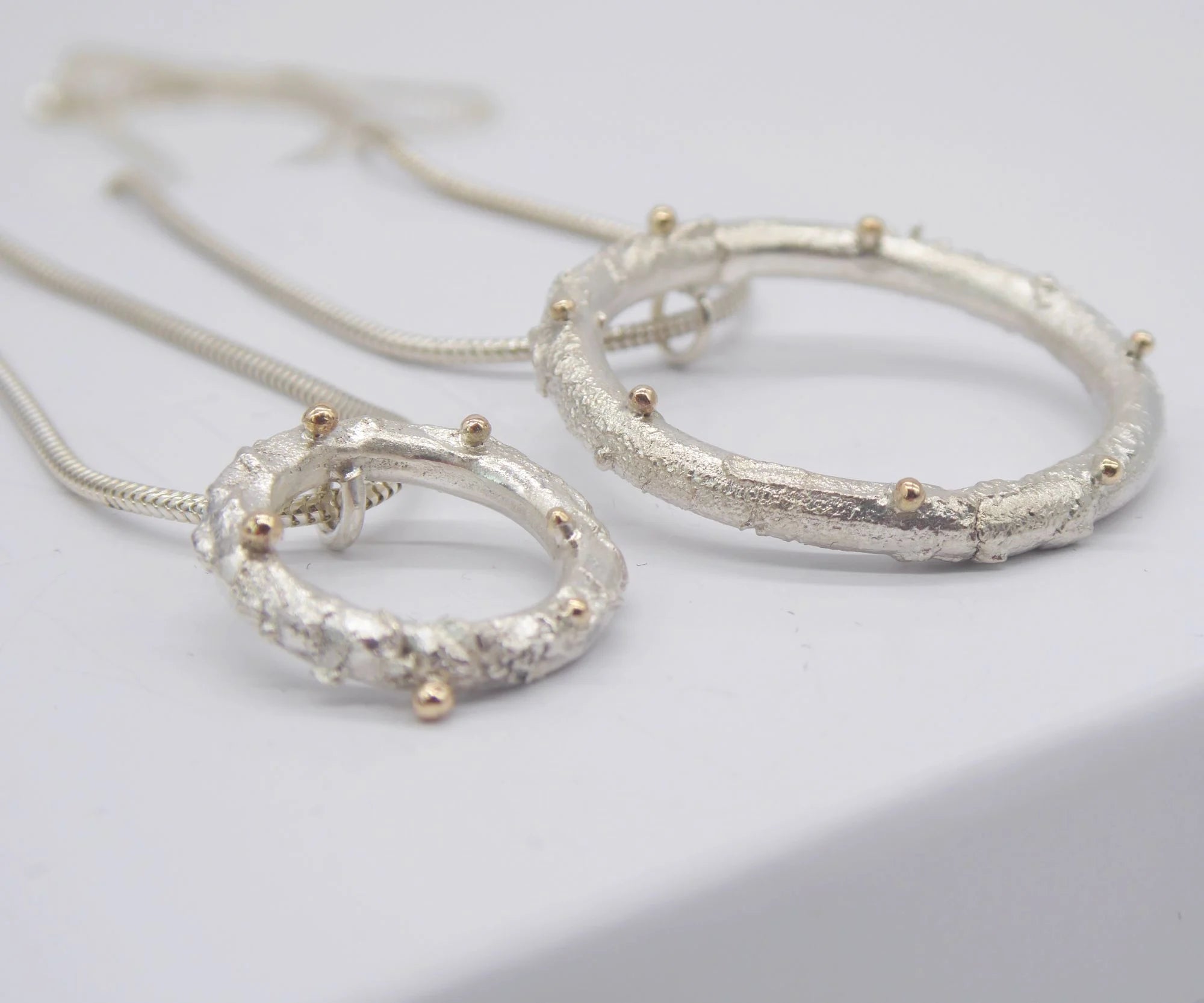 Rivda: Organic Textured Loop Pendant | Silver & 9ct Gold Detail