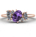Front view of the Atlantis engagement ring, featuring an asymmetrical cluster of violet sapphires and brilliant diamonds set in warm 18ct rose gold.