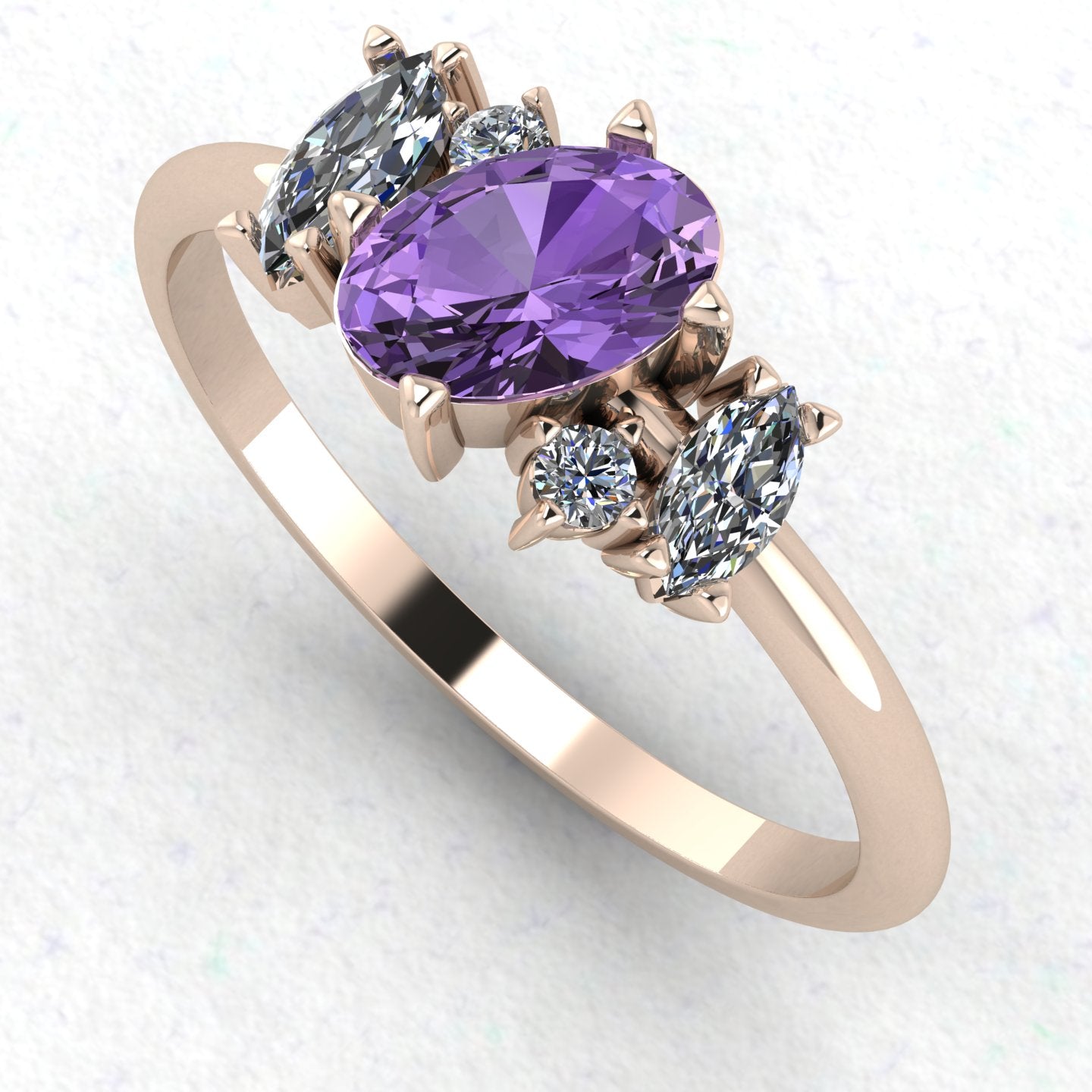 An angled perspective of the Atlantis violet sapphire ring, showcasing the organic, handmade design and the soft lilac hues against the polished rose gold band.