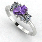 An angled perspective of the Atlantis ring, showcasing the contemporary organic design and the soft violet tones against the polished white metal band.