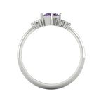 A view looking through the band, detailing the intricate under-gallery and the secure mounting of the violet sapphire and diamond stones.