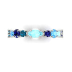 Modern blue sapphire eternity ring styled as a unique wedding band or anniversary gift, handcrafted in our Surrey studio.