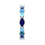 Unusual blue gemstone eternity band showing the hand-finished setting and tonal sapphire palette, handmade in the UK.