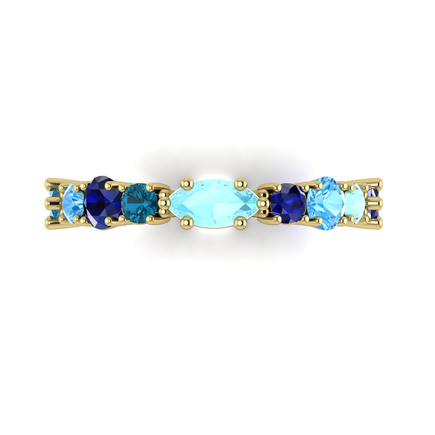 Macro detail of the True Blue ring showcasing the contrast between the deep blue sapphires and the light blue tones of the aquamarine and topaz.