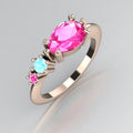 Comet Ring: Pear Shaped Pink Sapphire's & Aquamarine Rose Gold Trilogy Ring