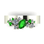 Top view of the Crystallised wide band ring showing oval tsavorite and scattered diamond cluster in 18ct white gold