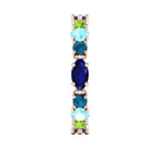 Detail of the Allsorts eternity ring in 18ct rose gold, focusing on the cool-toned blue sapphires and aquamarines hand-set into the band