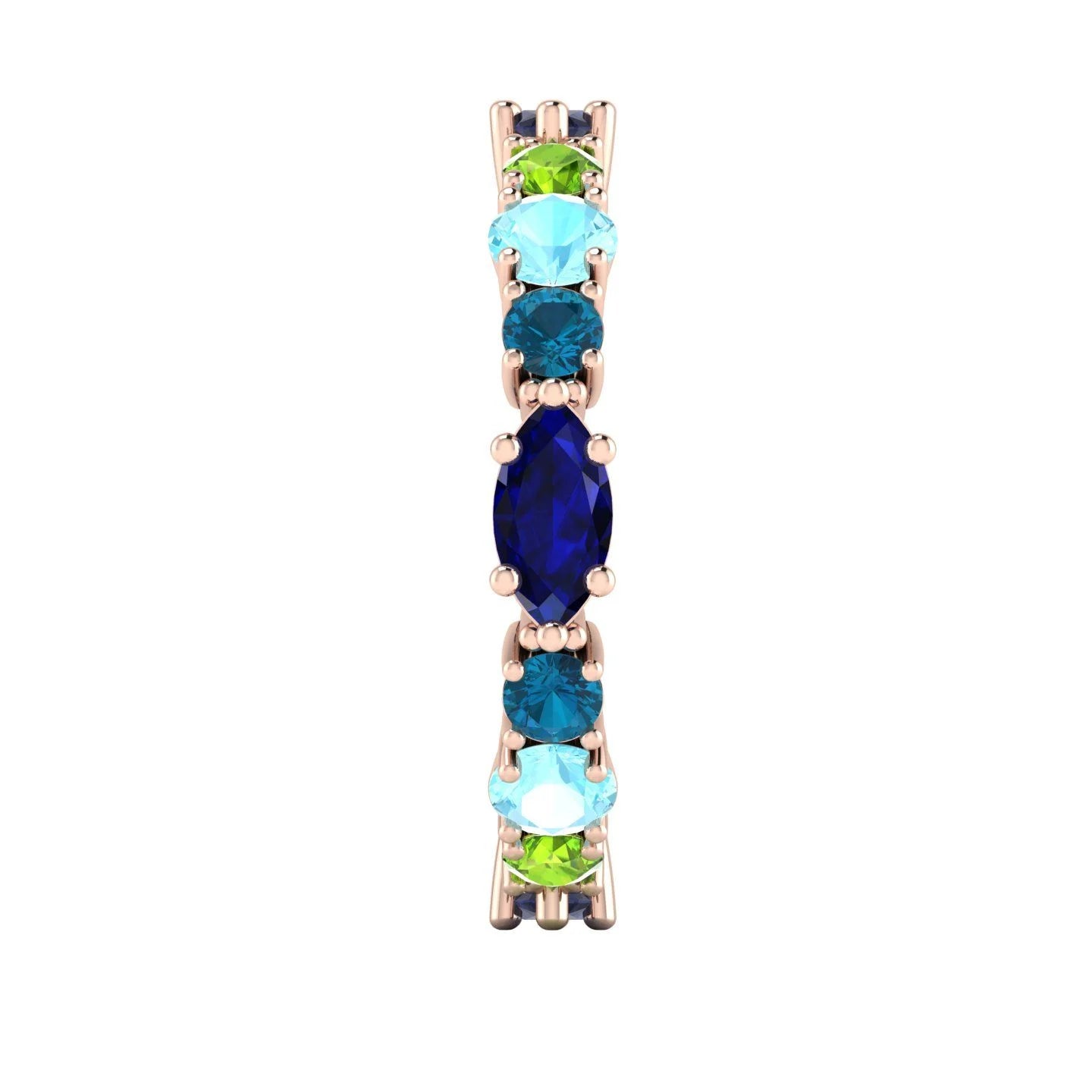 Detail of the Allsorts eternity ring in 18ct rose gold, focusing on the cool-toned blue sapphires and aquamarines hand-set into the band