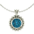 A front-facing view of the Alto Majestic pendant, featuring a round, brilliant-cut London Blue Topaz gemstone set within a high-polished recycled silver geometric frame.