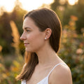 Model image with the Alto silver and white pearl stud earrings.