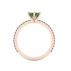A through-finger view of the Amoret tourmaline ring showing the internal rose gold band and clean setting symmetry.
