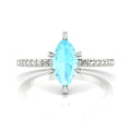 Profile view of the Amoret engagement ring showing the elegant silhouette of the central marquise aquamarine and low-profile setting.