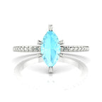 Profile view of the Amoret engagement ring showing the elegant silhouette of the central marquise aquamarine and low-profile setting.
