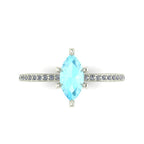 Top-down view of the Amoret ring showing the symmetrical marquise aquamarine and the sparkle of the brilliant-cut diamond shoulders.