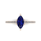 Top-down view of the Amoret ring showing the symmetrical marquise blue sapphire and the brilliant-cut diamond shoulders.