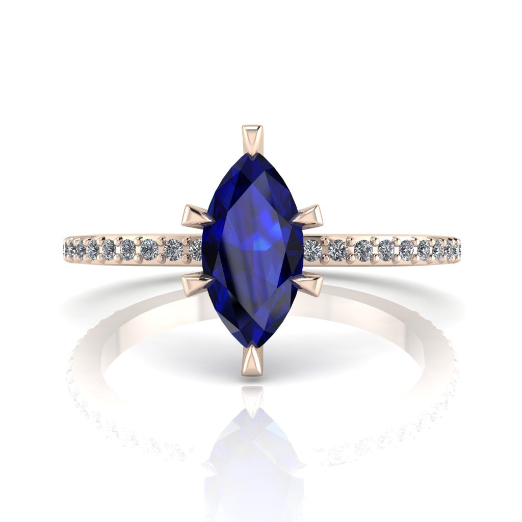 Profile view of the Amoret engagement ring showing the elegant silhouette of the marquise blue sapphire and the diamond-set rose gold band.