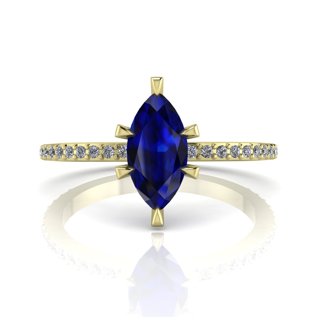 Profile view of the Amoret engagement ring in 18ct yellow gold showing the elegant silhouette of the marquise blue sapphire and diamond-set shoulders.