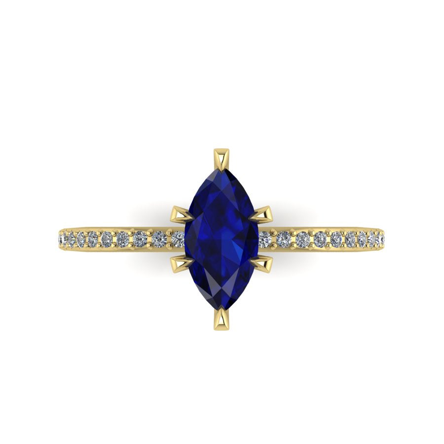 Top-down view of the Amoret ring showing the symmetrical marquise blue sapphire and the sparkle of the brilliant-cut diamond shoulders.