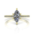 Profile view of the Amoret diamond engagement ring in 18ct yellow gold showing the architectural marquise silhouette and grain-set shoulders.