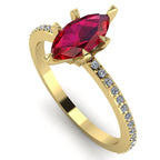 Profile view of the Amoret ruby ring in 18ct yellow gold showing the elegant marquise silhouette and grain-set diamond shoulders.