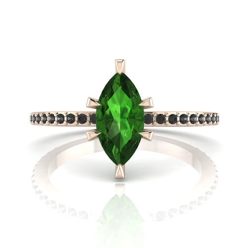 Front profile view of the Amoret green tourmaline ring in 18ct rose gold showing the marquise silhouette and grain-set black diamond shoulders.