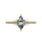 Top-down view of the Amoret engagement ring showing the symmetrical marquise lab diamond and the diamond-set yellow gold band.
