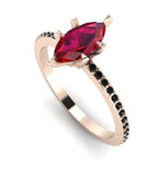 Profile angled view of the Amoret ruby ring in 18ct rose gold showing the marquise silhouette and grain-set black diamond shoulders.