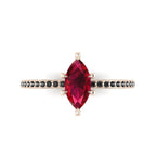 Top-down view of the Amoret ring showing the symmetrical marquise ruby and the dark sparkle of the black diamond shoulders.