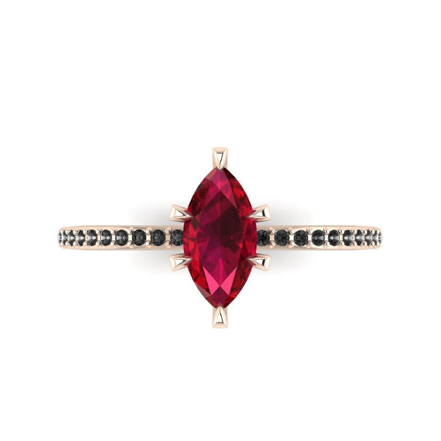 Top-down view of the Amoret ring showing the symmetrical marquise ruby and the dark sparkle of the black diamond shoulders.