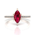 Profile view of the Amoret ruby ring in 18ct rose gold showing the elegant marquise silhouette and low-set diamond shoulders.