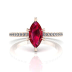 Profile view of the Amoret ruby ring in 18ct rose gold showing the elegant marquise silhouette and low-set diamond shoulders.