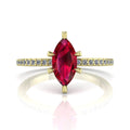 Profile view of the Amoret ruby ring in 18ct yellow gold showing the elegant marquise silhouette and grain-set diamond shoulders.