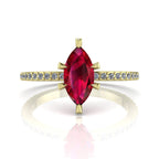 Profile view of the Amoret ruby ring in 18ct yellow gold showing the elegant marquise silhouette and grain-set diamond shoulders.