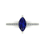 Top-down view of the Amoret ring showing the symmetrical marquise sapphire and the sparkle of the brilliant-cut diamond shoulders against white gold or platinum.