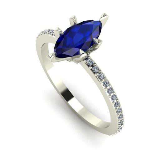 Angled profile view of the Amoret sapphire ring in 18ct white gold or platinum showing the elegant marquise silhouette and grain-set diamond shoulders.