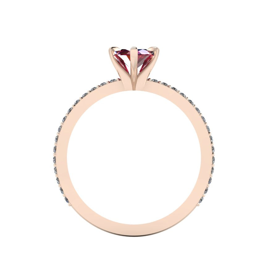 A through-finger view of the Amoret ruby ring showing the internal rose gold band and clean setting symmetry.