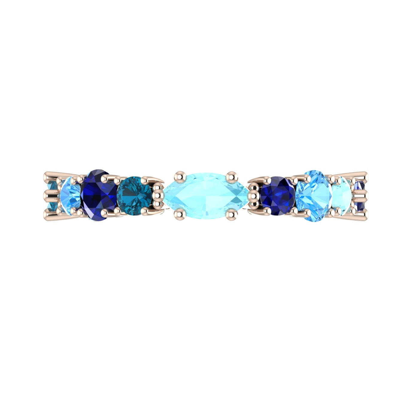 Close-up of an artisan sapphire and topaz ring, showcasing the independent British jewellery craftsmanship and recycled rose gold.