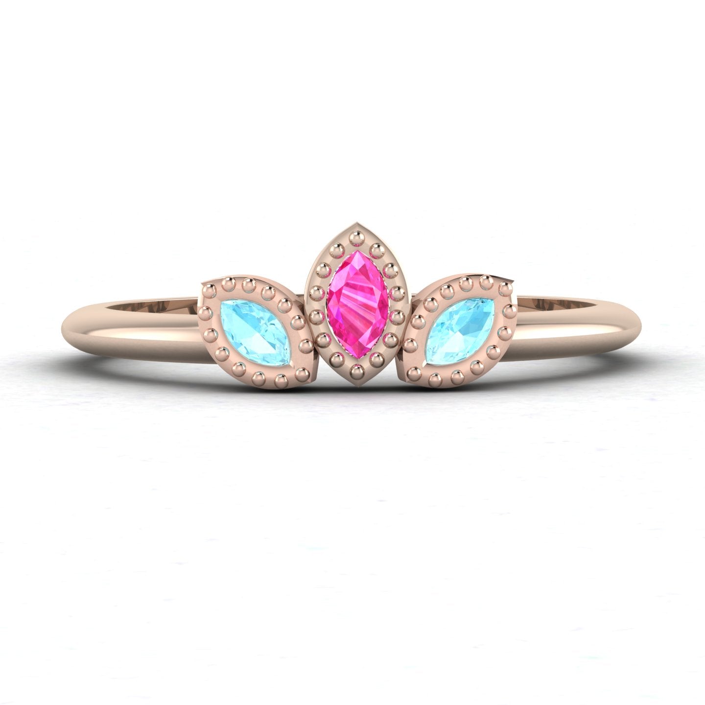 Front view of the Astraea Echo trilogy ring featuring an aquamarine centre and pink sapphire marquise shoulders in 18ct rose gold.