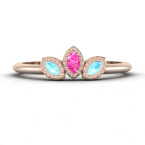 Front view of the Astraea Echo trilogy ring featuring an aquamarine centre and pink sapphire marquise shoulders in 18ct rose gold.