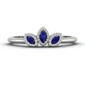 Front view of the Astraea Echo trilogy ring featuring a blue sapphire centre and blue sapphire marquise shoulders in white gold or platinum.